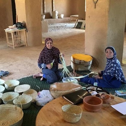 Bourse en feuilles de palmier et cuir tissé main - Casa Nomade